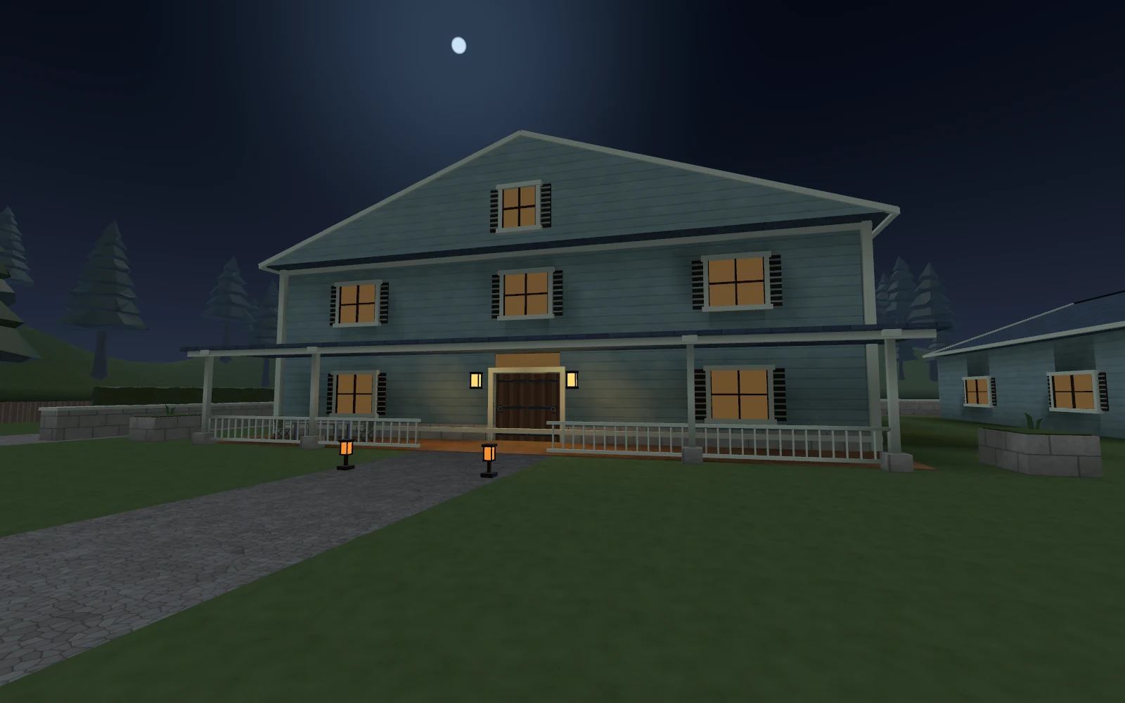 Cedar Estate’s two-storey house, illuminated porch and gravel approach at night